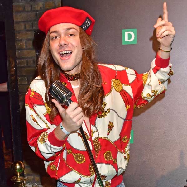 Riccardo Simonetti with a microphone at the Deichmann Fashion Talk in London